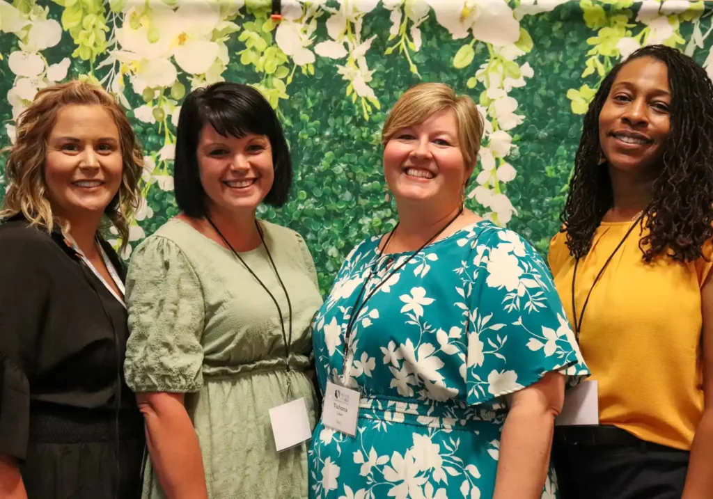 CLEE Team members take a photo at an event