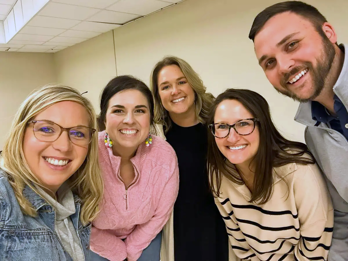 Teachers smiling at a Preschool AALN gathering