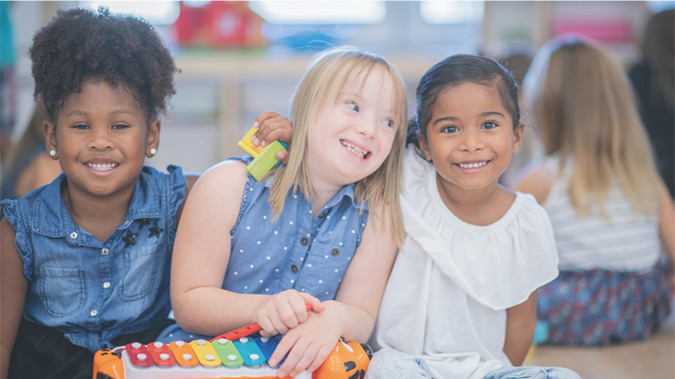 A picture of three preschool students