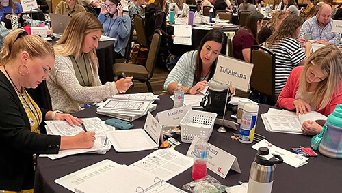 A photo of teachers working in a workshop setting