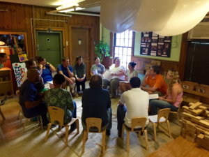 Families sitting together in circle.