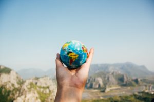 small globe being held in hand