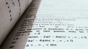 book opened to page of equations