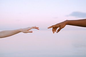 fingers reaching out to touch
