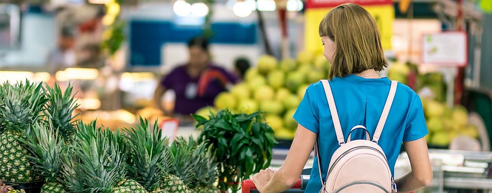 woman-standing-beside-pineapple-fruits-2292919