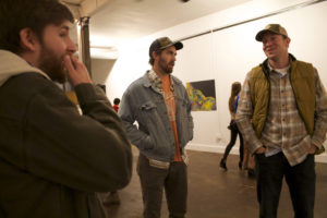 Three attendees with hats Art Ed Exhibition