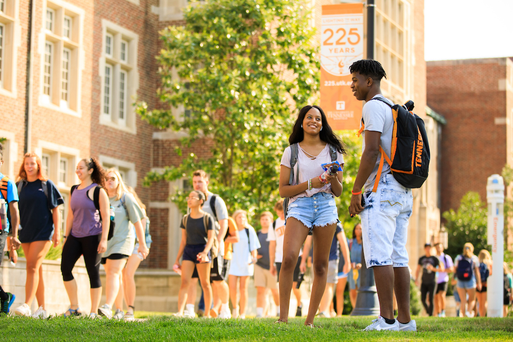 A student hangout and visit outside Ayres Hall during the first day of fall classes on August 21, 2019. Photo by Steven Bridges/University of Tennessee