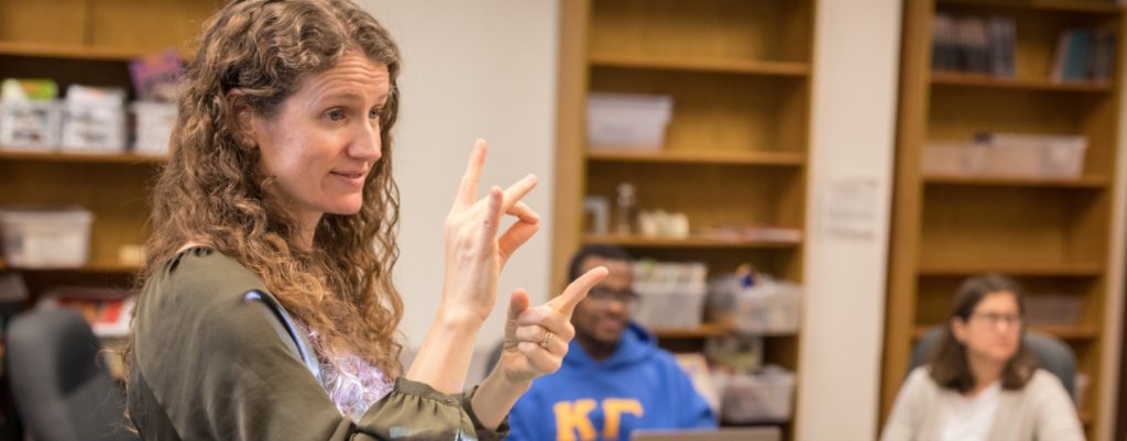 Kimberly Wolbers teaching sign language in a Deaf Studies class