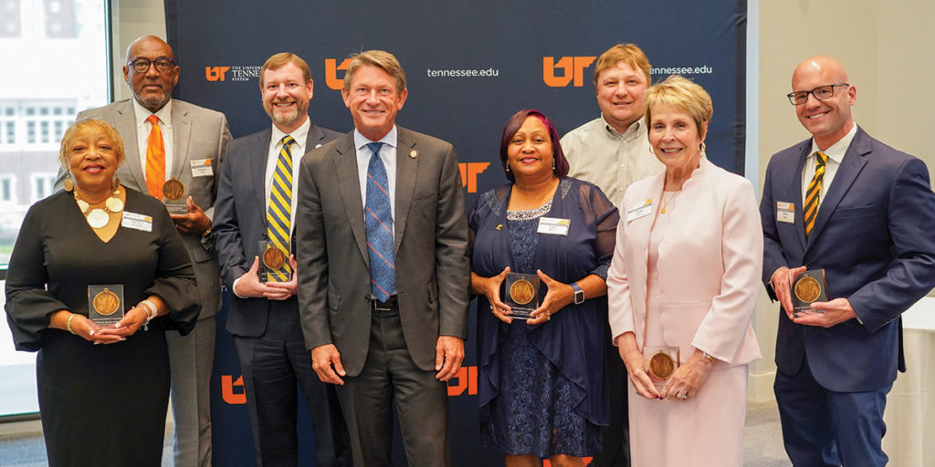 President's Award winners stand with Randy Boyd