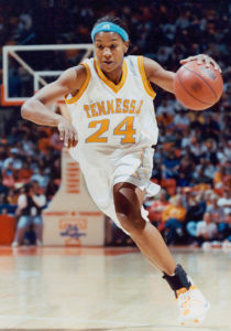 Tamkia Catchings playing basketball on basketball court as a UT Lady Vol